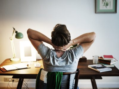 Man stressed while working on laptop